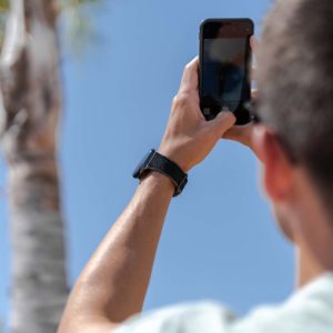 Gloomy-Apple-watcblack-rubber-band-with-a-palm-beach-on-behind